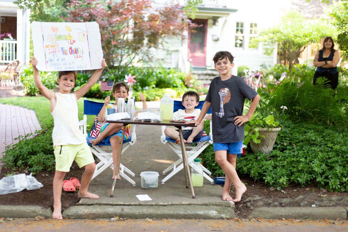 Children at an outdoor activity table